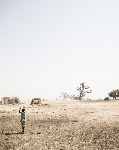 young Fulani woman carrying water