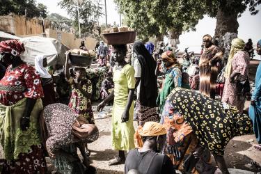 Women at market with baskets 